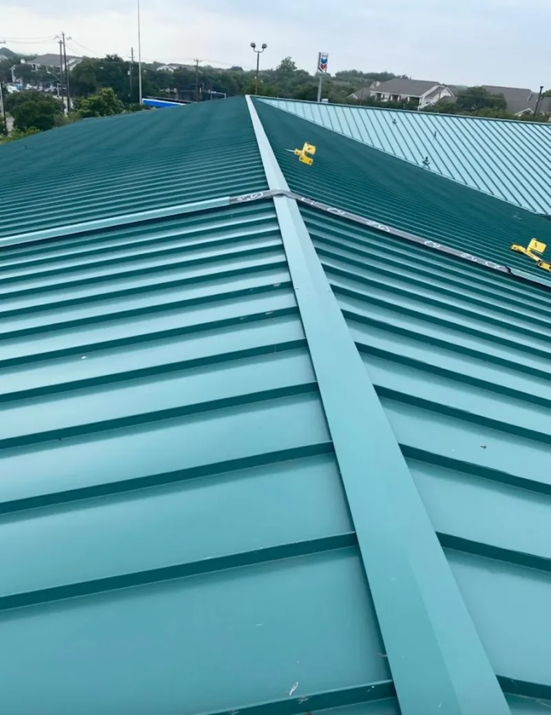 Green commercial metal roof ridge and valley for Metal Roof Repair in Highlands Ranch