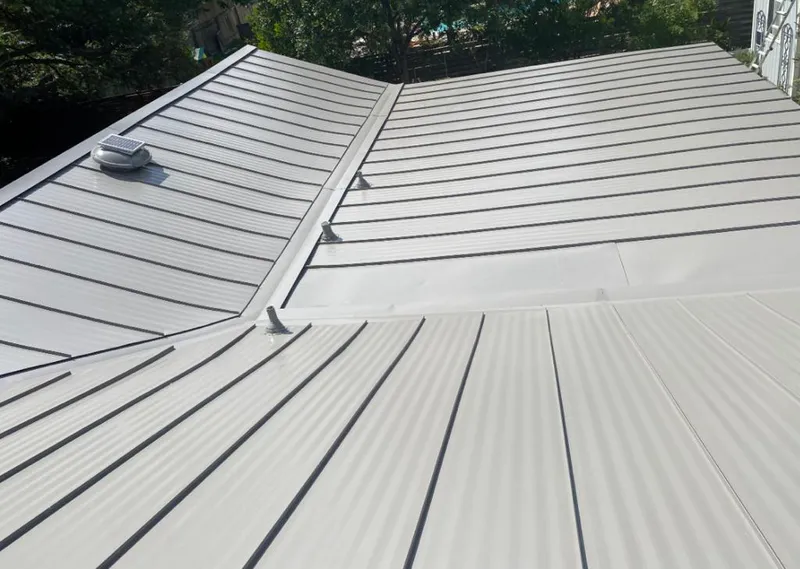 Solar attic fan installed on a metal roof for Roof Ventilation in Highlands Ranch